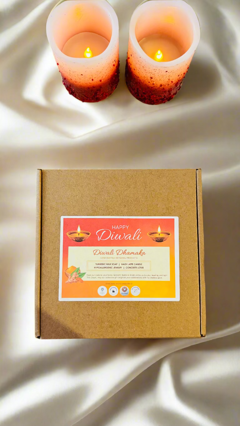 Box with Diwali card and candles on a marble surface