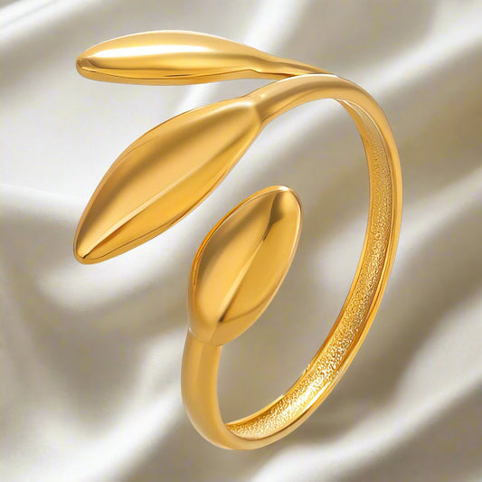 Gold plated and leaf design ring that is adjustable in size