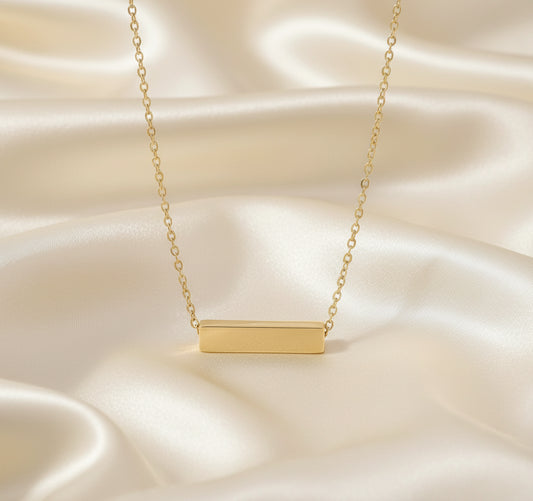 Gold bar necklace on a white background with color swatches below.