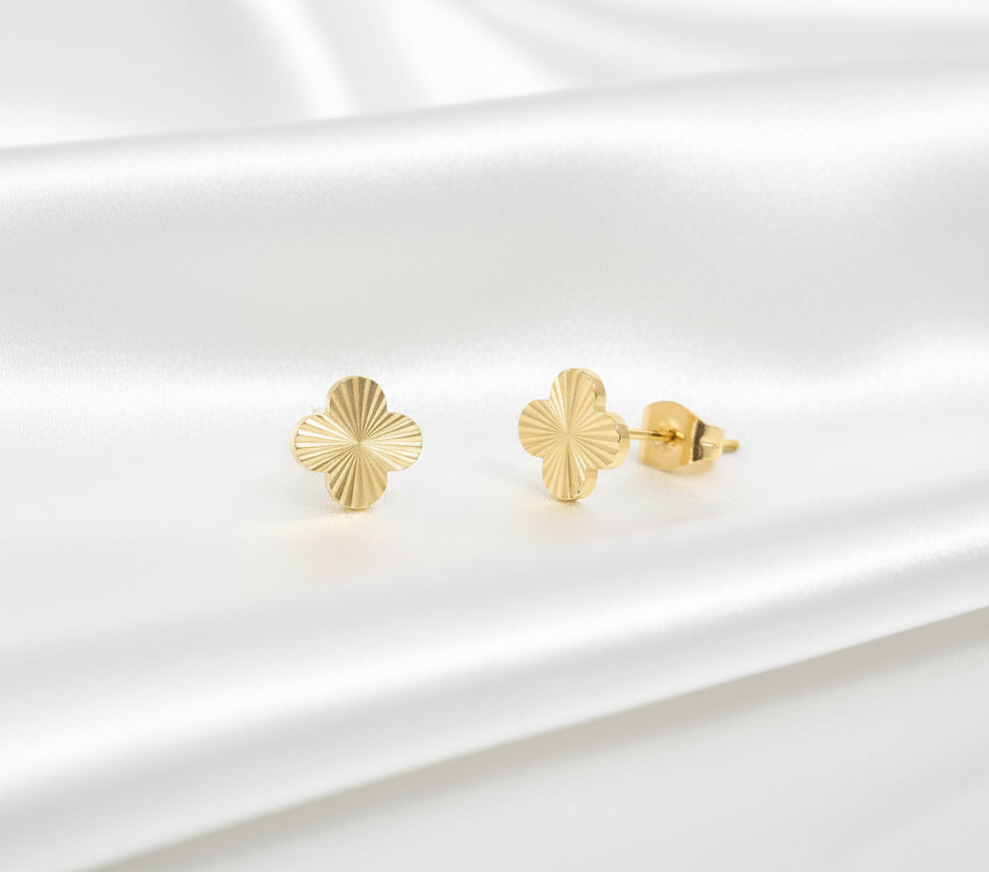 clover Gold earrings on a white background